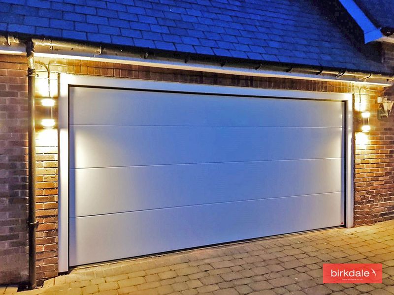 White garage door with lights