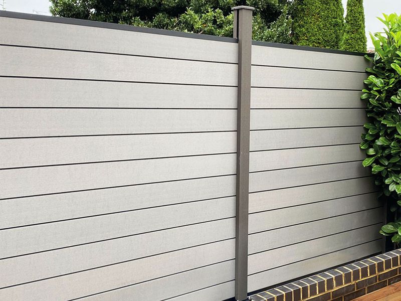 Close-up of a beige garden fence