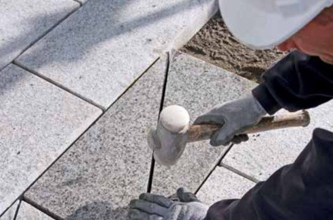 Mallet-hitting-paving-slabs